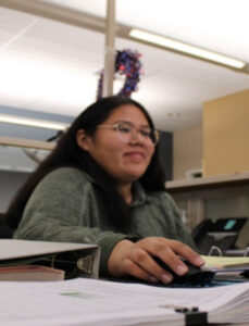 Student working at computer in a classroom.